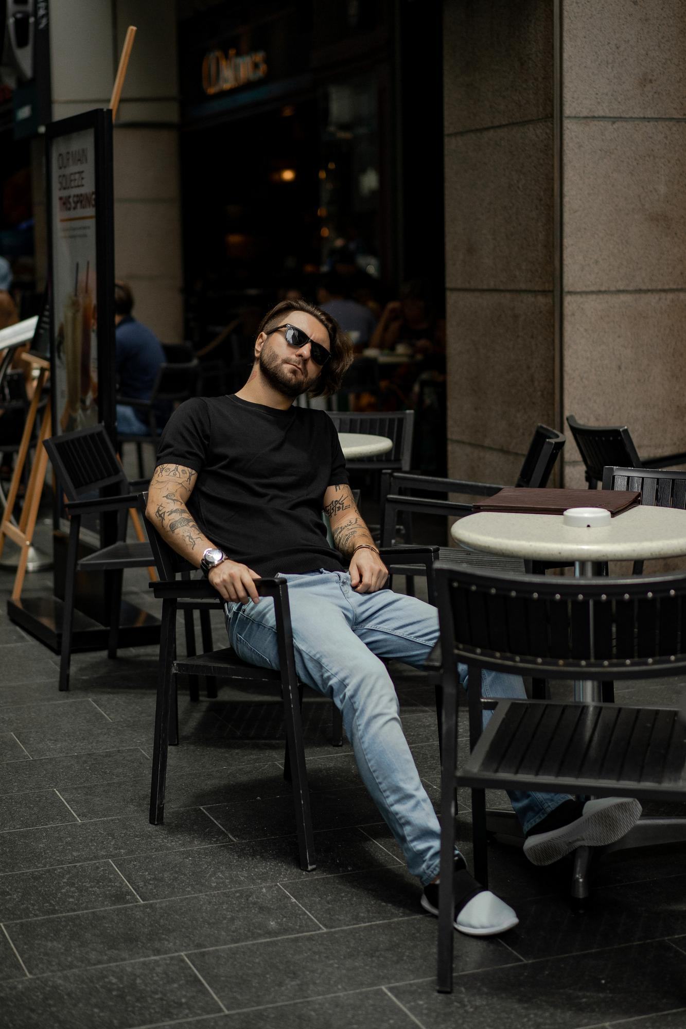 black t-shirt at outdoor cafe